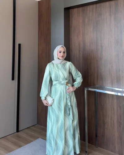 Model wearing the Safira Dress in Green